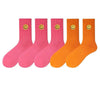 solid-color-medium-tube-socks-for-womens-fresh-smiling-face-pattern-simple-style-comfortable-breathable-girl-socks